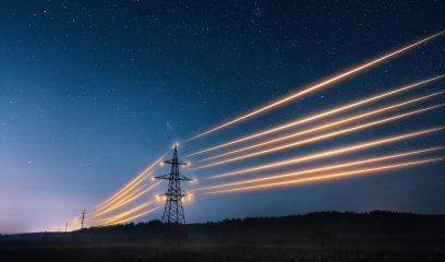 Electricity,Transmission,Towers,With,Orange,Glowing,Wires,The,Starry,Night
